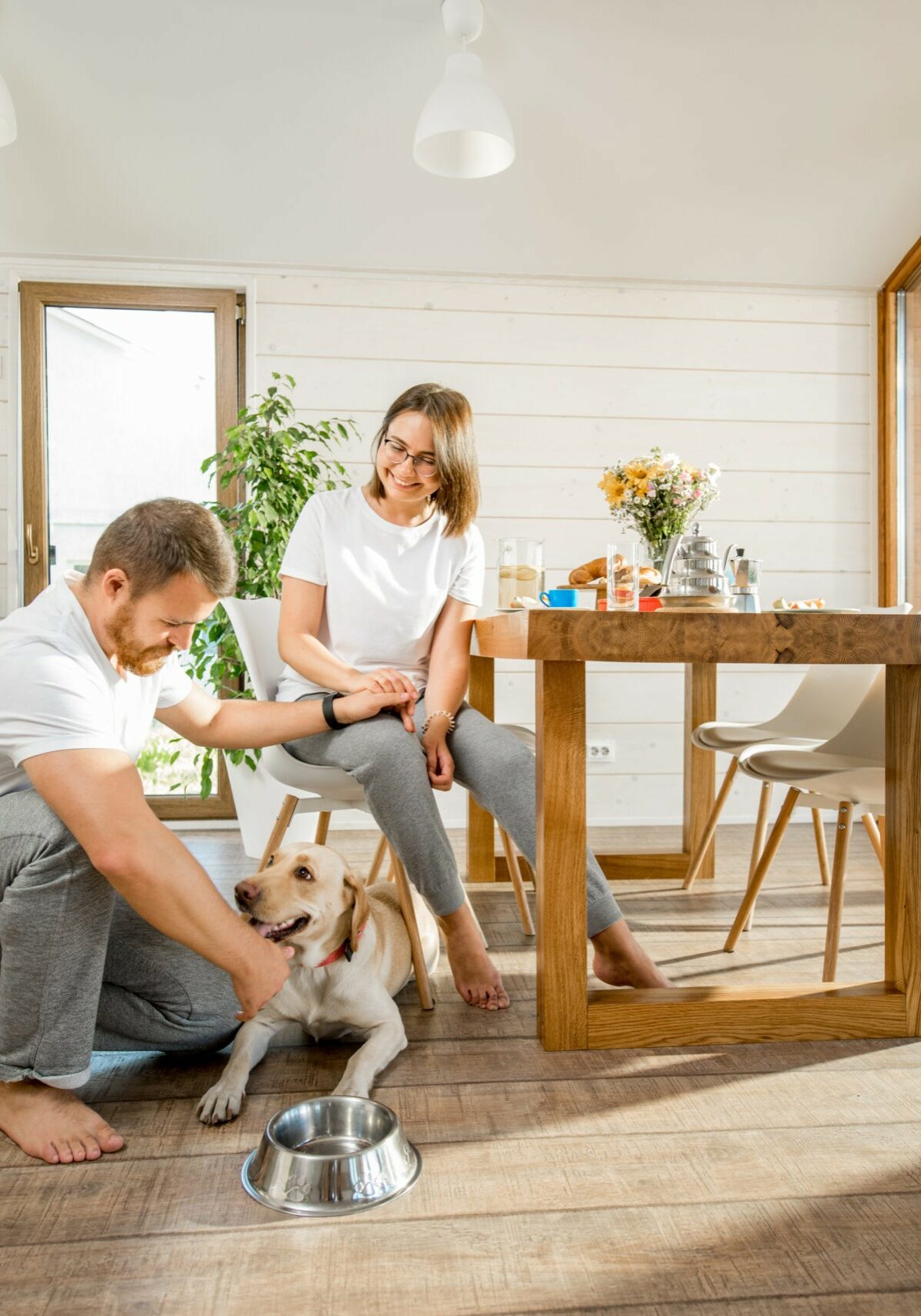 Young couple with dog at home | Sullivan & Son Carpet